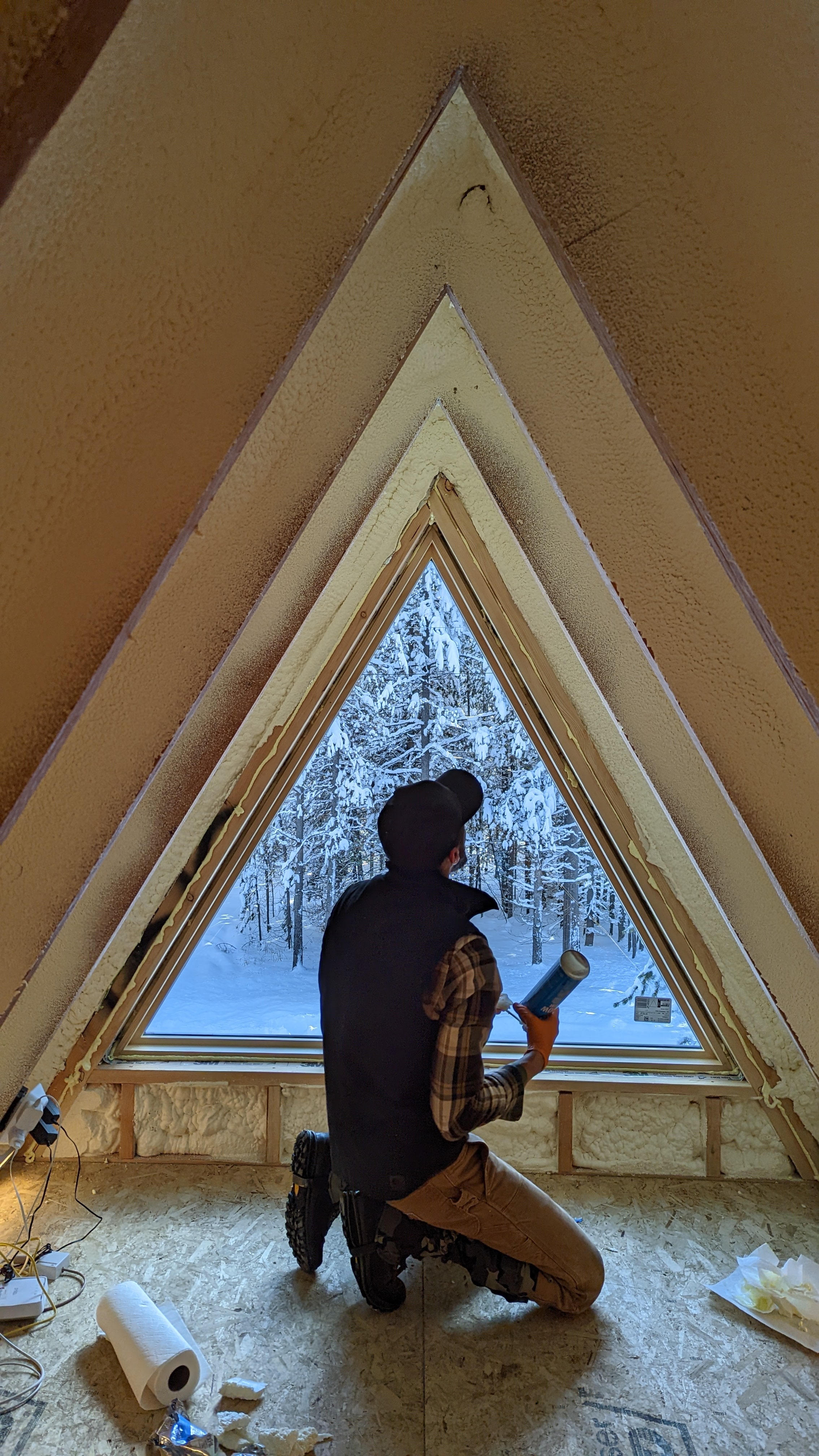 Photo of man installing a window.