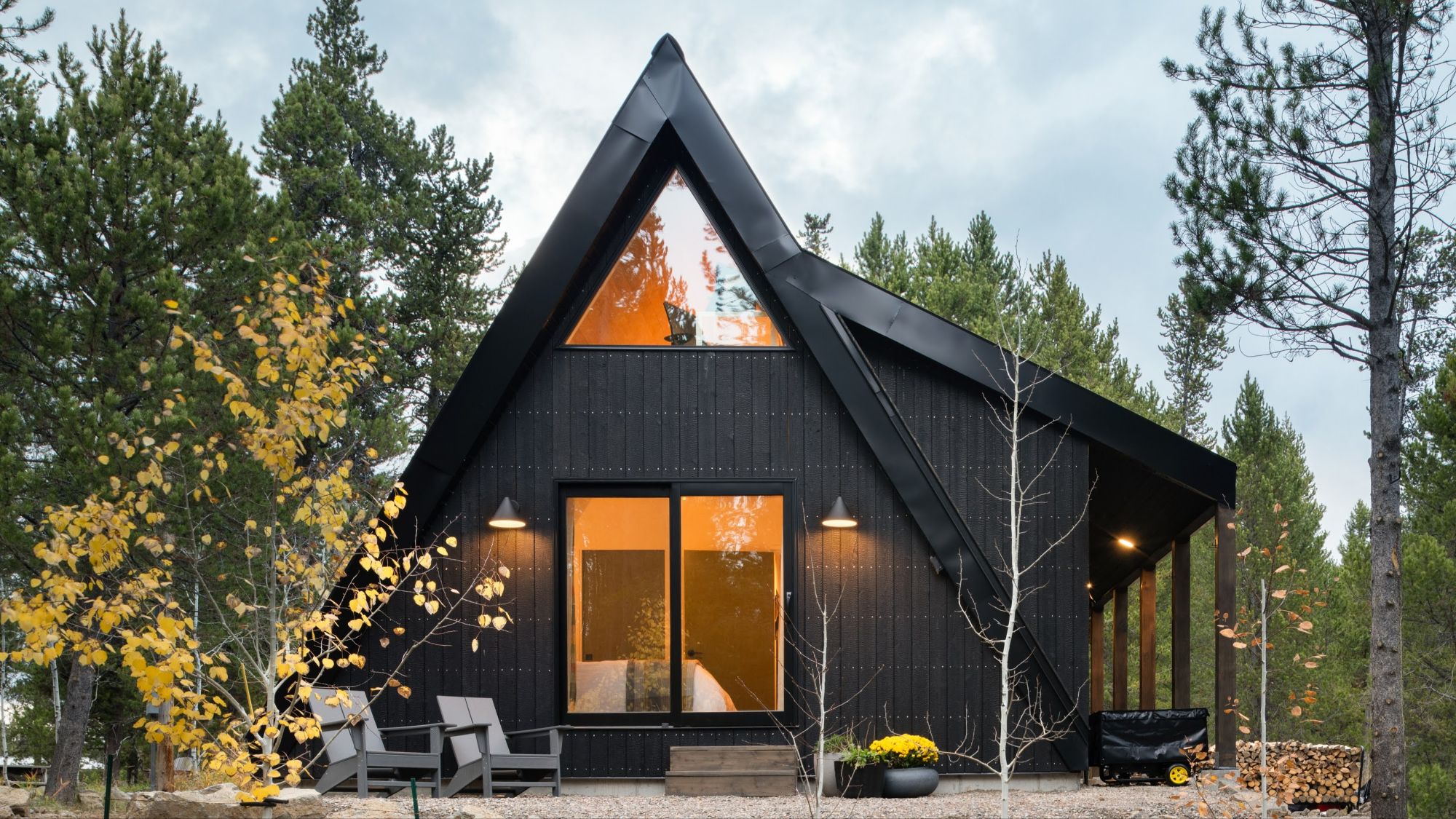 Photo of a-frame cabin in the woods.